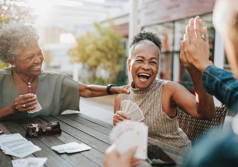older women socializing together outside